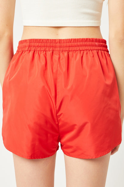 Orange Pair Of Windbreaker Shorts