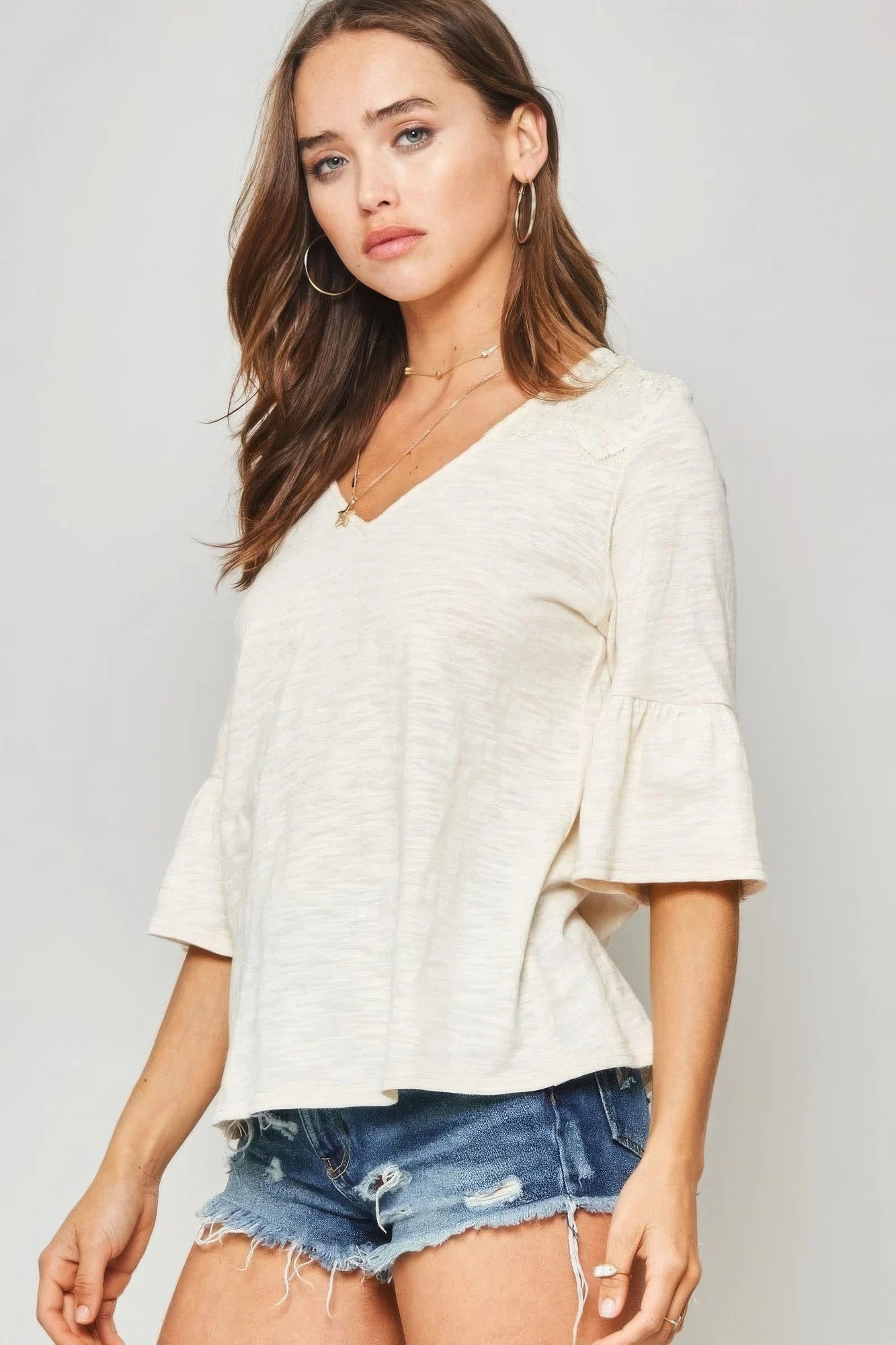 White Knit Top With Deep V Neckline And Yoke Design