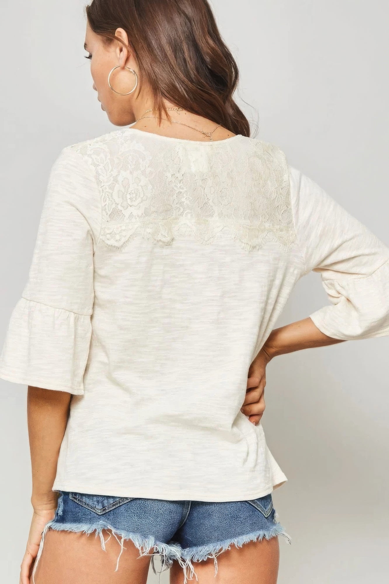 White Knit Top With Deep V Neckline And Yoke Design